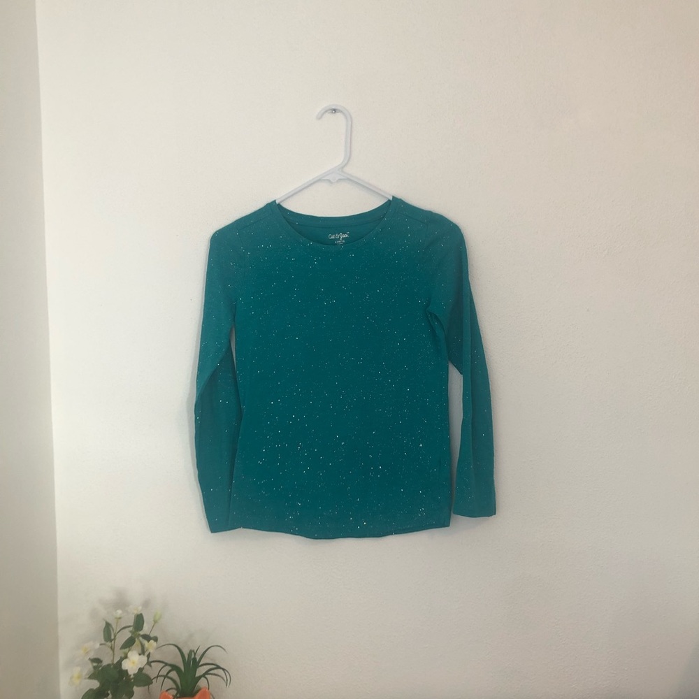A great quality blue sparkly long sleeve shirt.